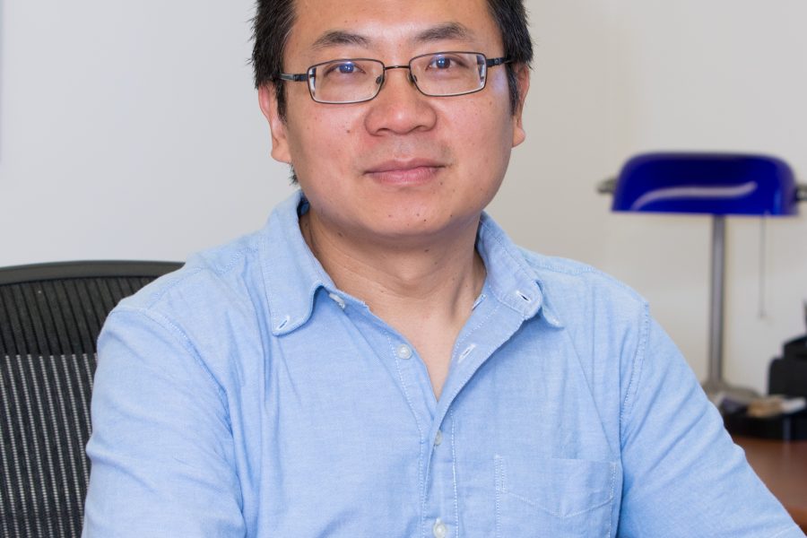 Professor seated at desk