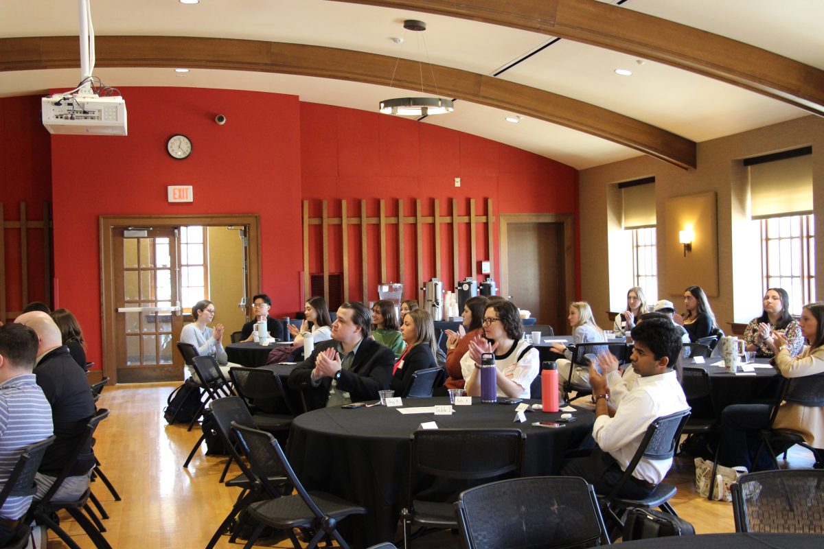 Carson Gulley Commons filled with Case Competition participants clapping for the final presenting group.